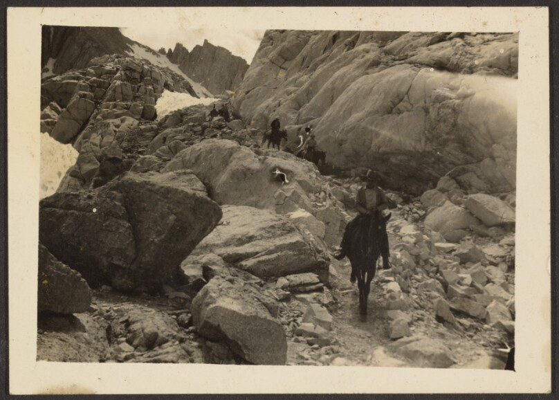 [Figure in Rocky Landscape]
