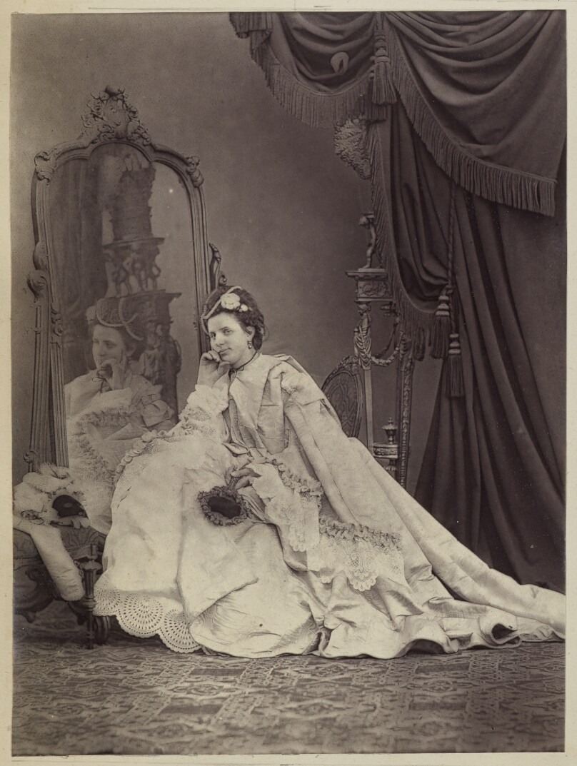 [Seated woman with mirror]