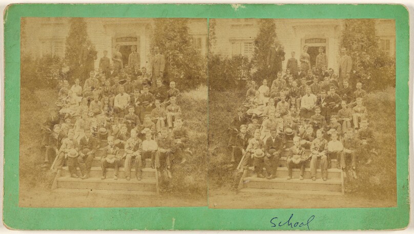 [School class portrait on steps of school]