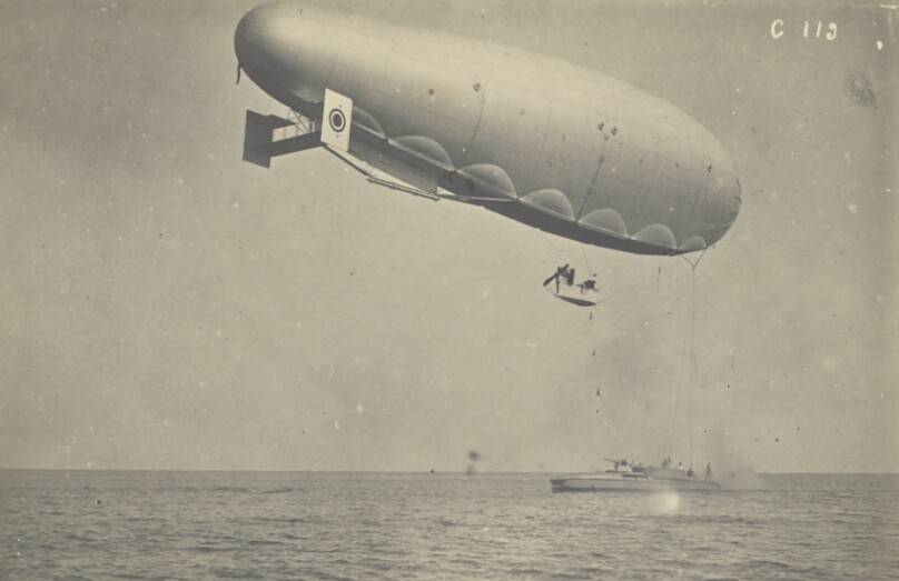 [Blimp attached to a boat]