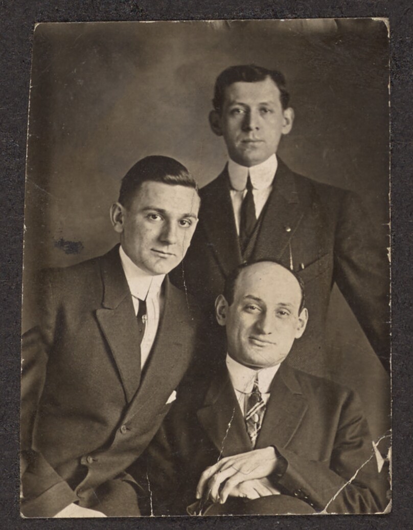 [Portrait of three men]