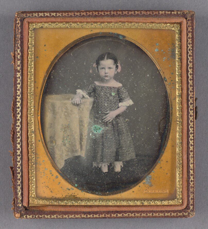[Portrait of a Little Girl at Cloth-covered Table]