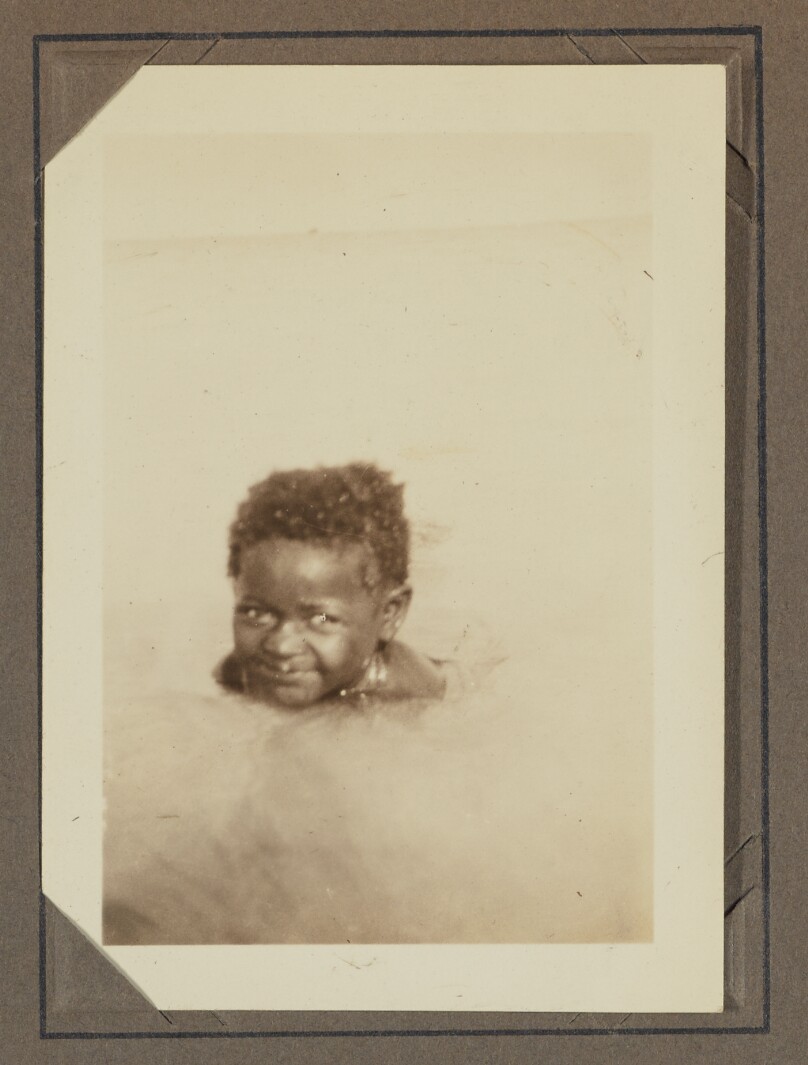 [A young child swimming]