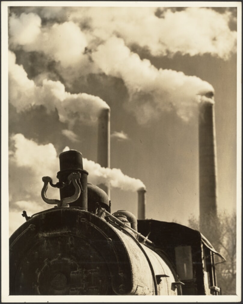 [Locomotive and smokestacks]