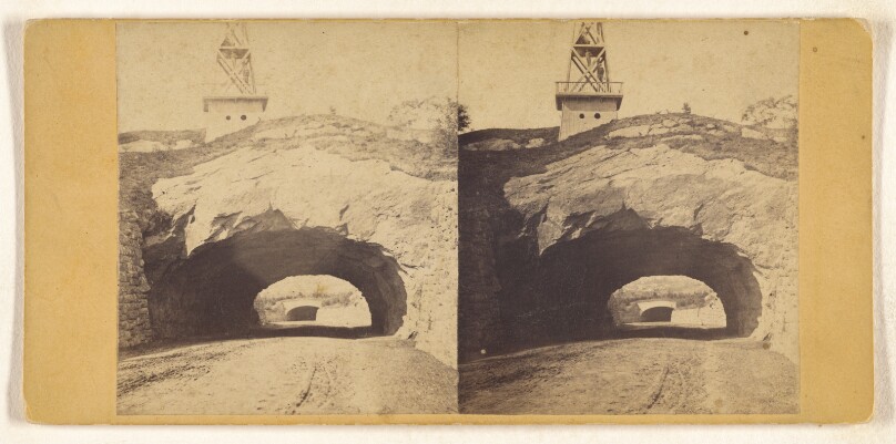 Tunnel in Traffic Road across the Park with temporary Bell Tower.
