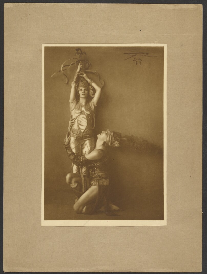 [Dancer lifting another dancer]
