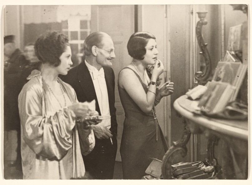 [Two Women and a Man at Presseball, Berlin Germany]
