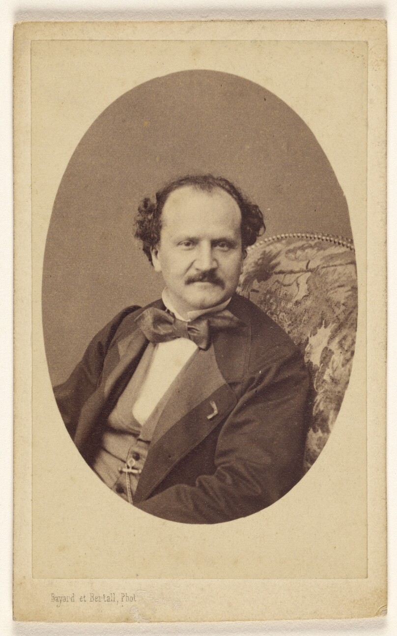 [Unidentified man with moustache, wearing a bow tie, seated]