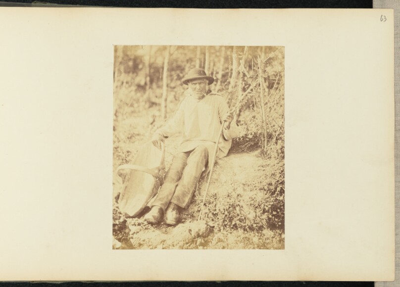 [Portrait of man with basket]