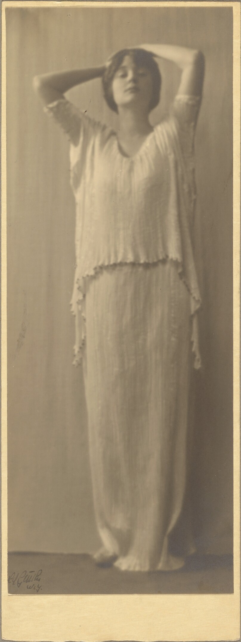 [Woman Wearing a Fortuny Dress]