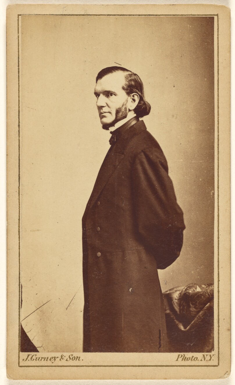 [Unidentified doctor or clergyman with full beard sans moustache, standing]