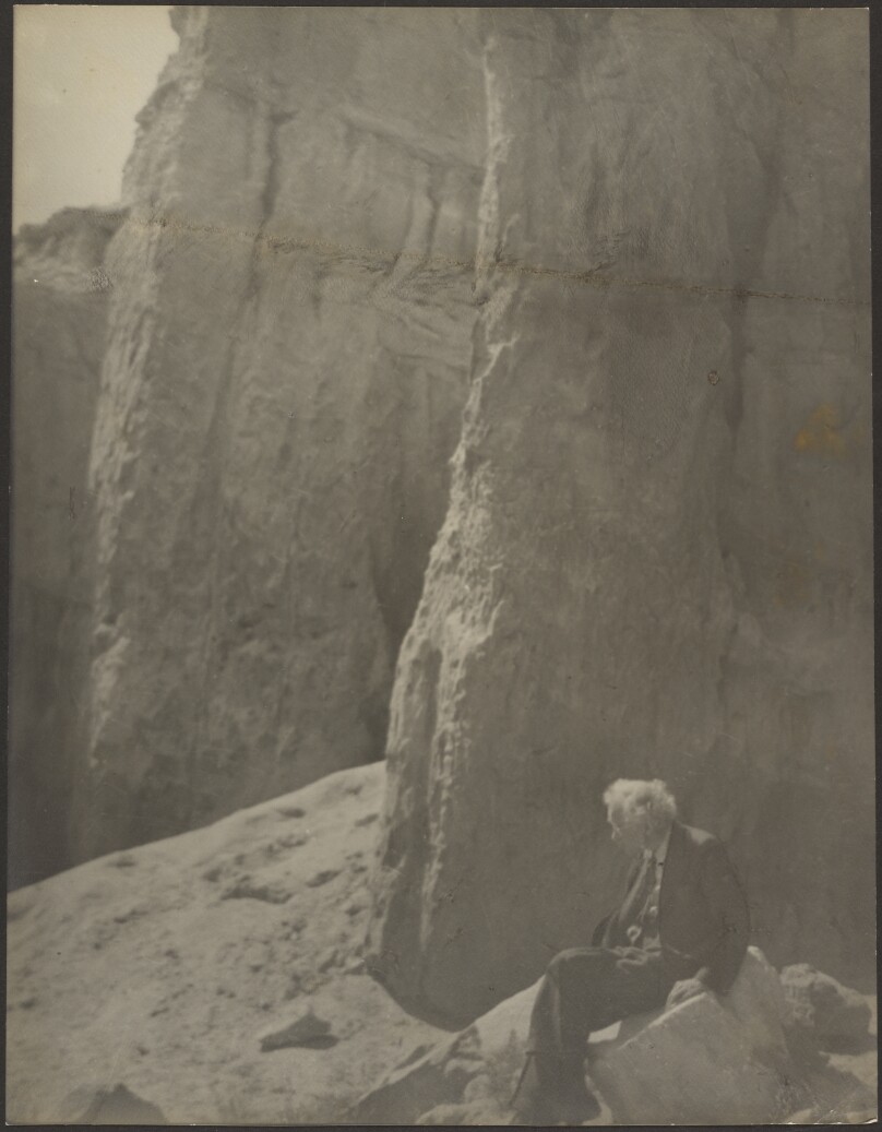 [Elderly Man in Rocky Landscape]
