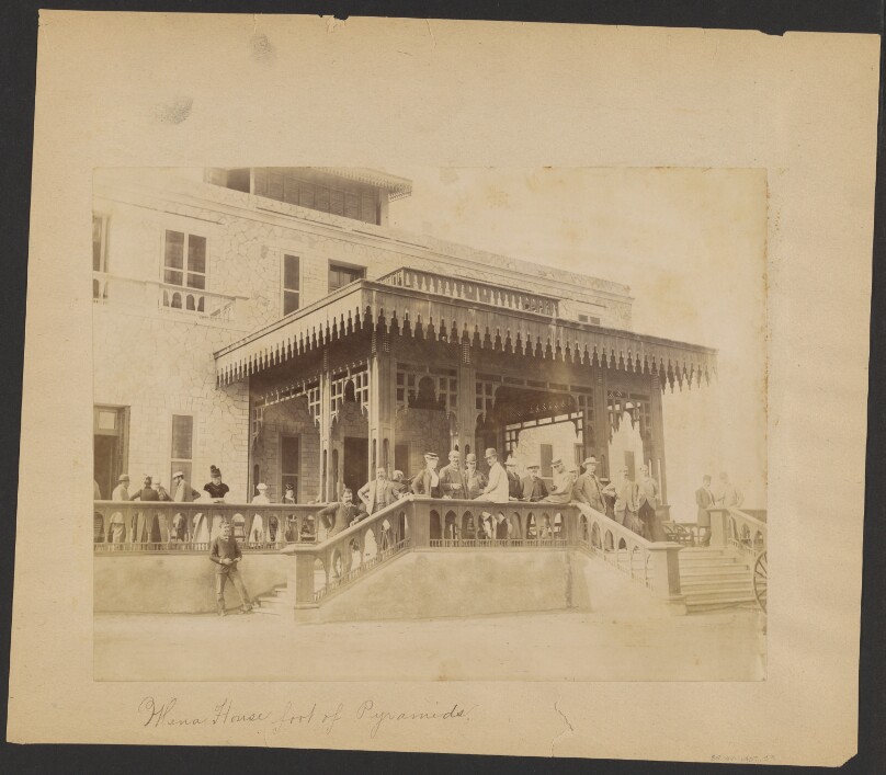 [Group portrait in front of house]
