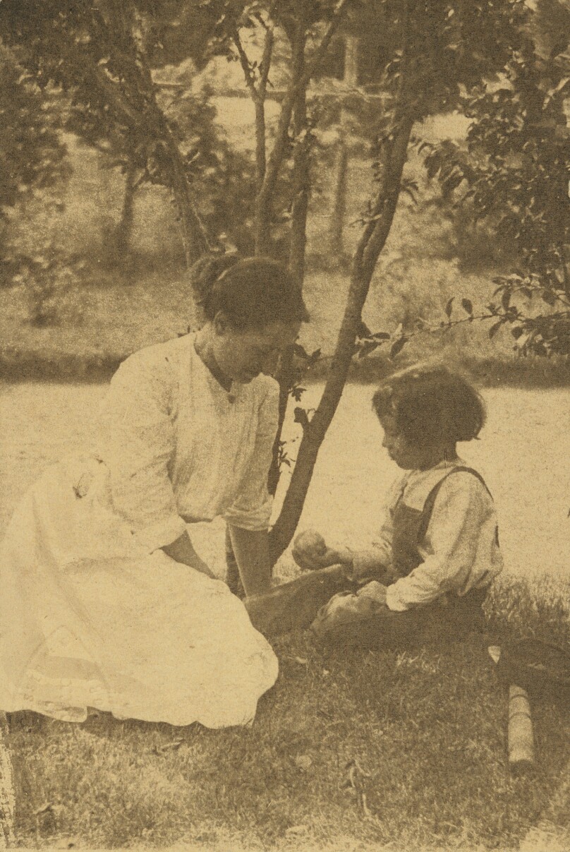 [Gertrude O'Malley and Charles seated by a stream]