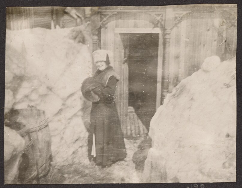 [Woman standing in the snow]