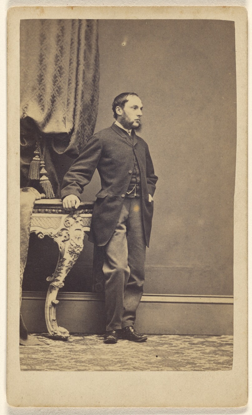[Unidentified man with long muttonchops, standing]