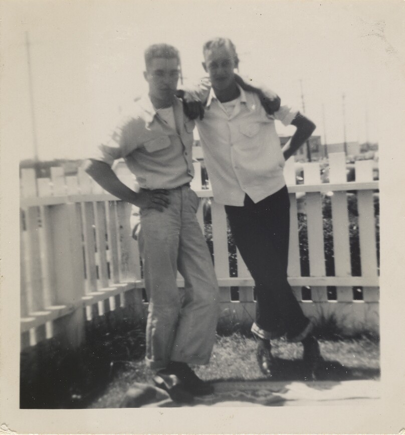 [Two men posing]