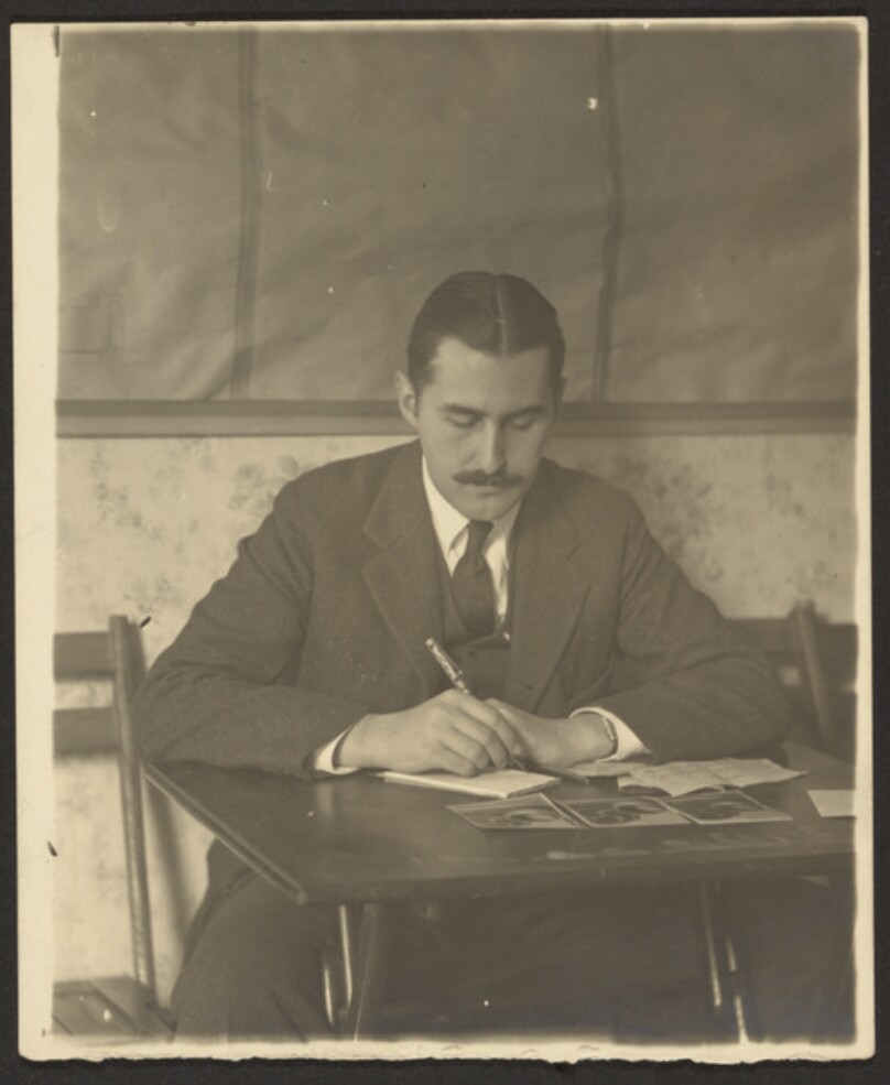 [Paul Outerbridge at Writing Table]