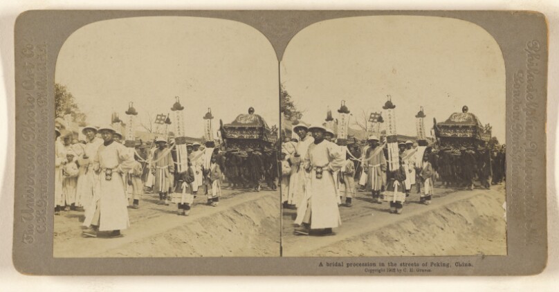 A bridal procession in the streets of Peking, China.