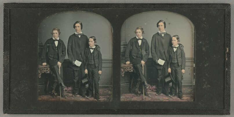 [Portrait of three well-dressed boys standing]