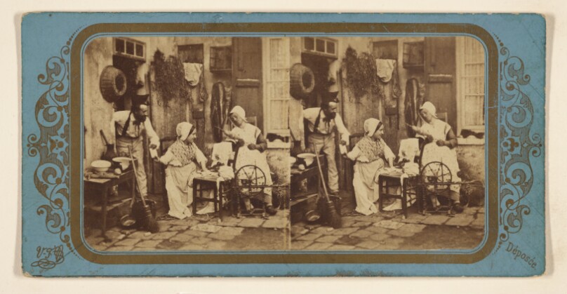 [Sewing scene: two women with thread and machine, man handing one of the women an object]