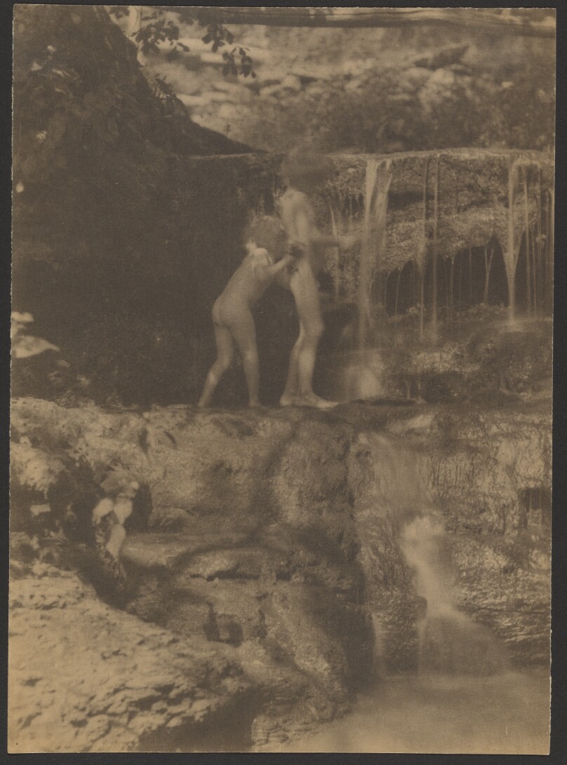 [Two children near waterfall]