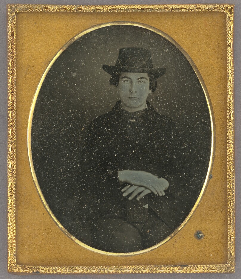 [Portrait of a Seated Man in Hat with Hands Crossed]