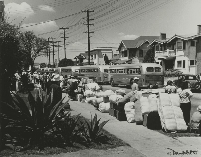 [People lined up for buses to internment camps]
