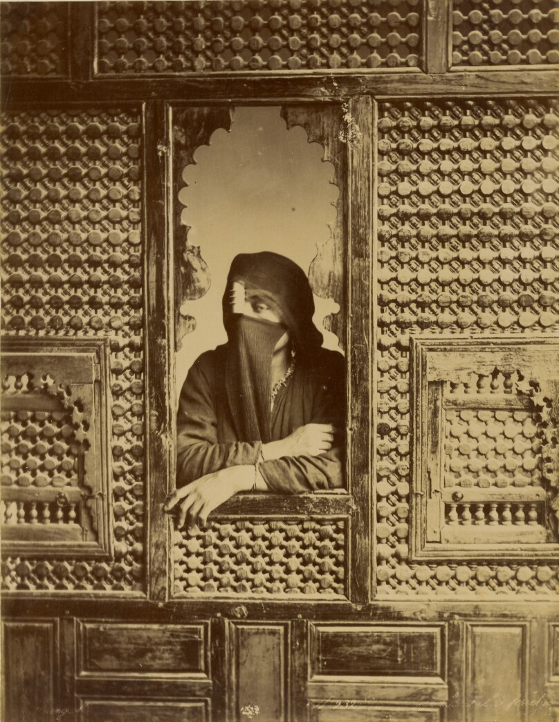 [Veiled Woman in Window]