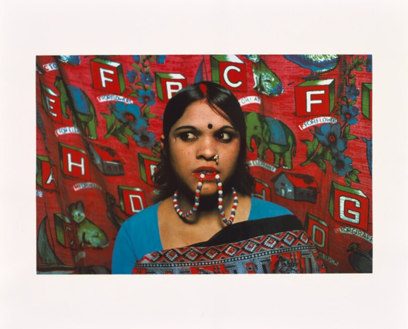 Rekha with beads in her mouth.