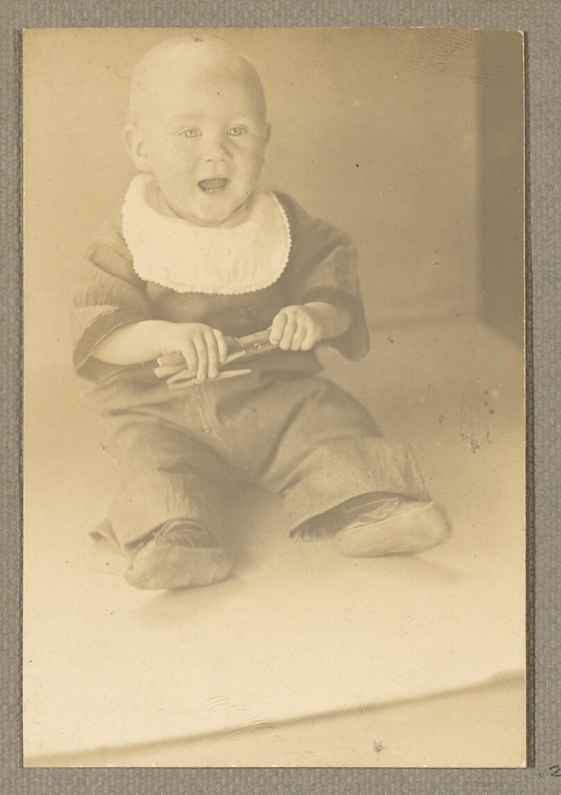 [Neil Weston seated, playing with clothes pins]