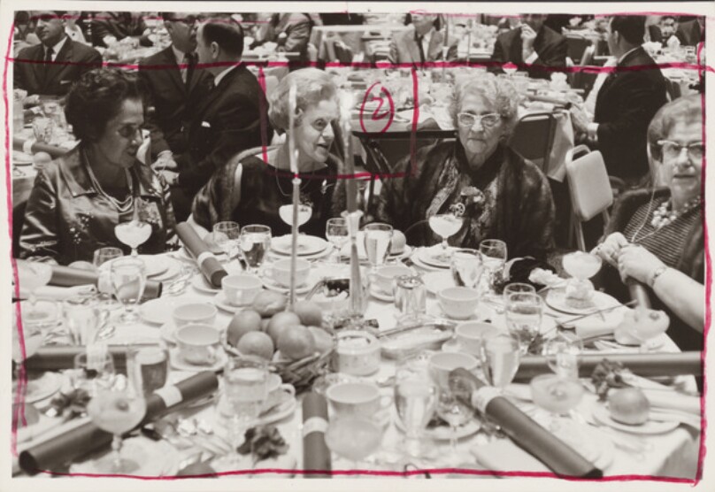 [Four women at a formal dinner]