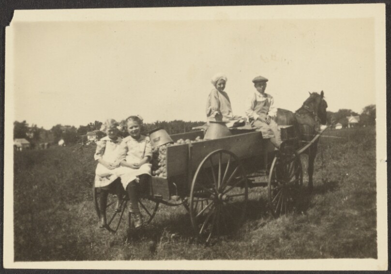 [Children sitting on wagon]