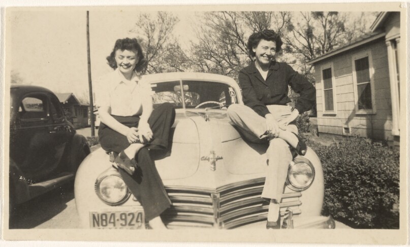 [Women sitting on car]