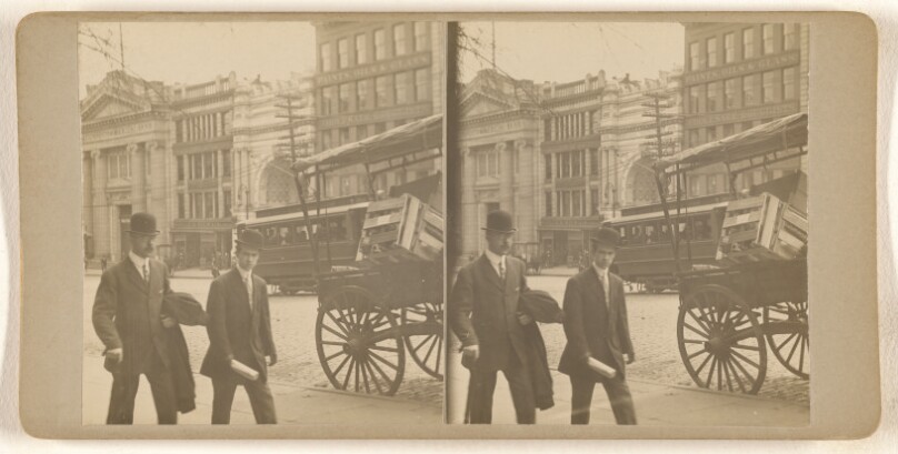 [Albany, N.Y. street scene, two men in derbies walking past a vegetable cart]