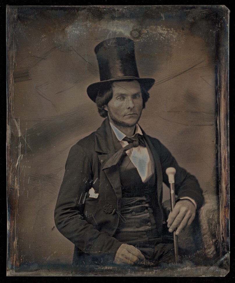 [Portrait of a Seated Man with Chin Beard in Top Hat Holding Walking Stick]