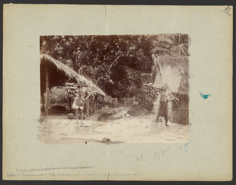 [Two Tahitian men carrying fruit]
