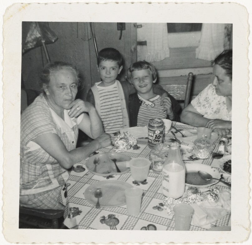 [Group at kitchen table]