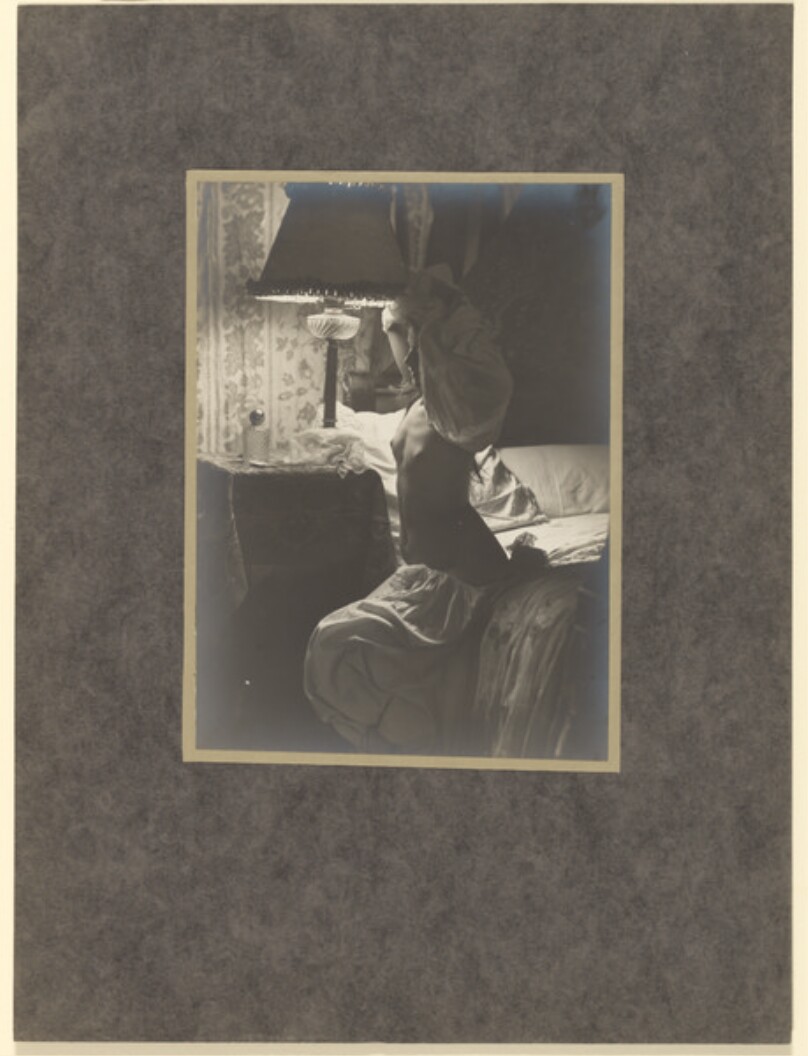 [Woman dressing for bed]