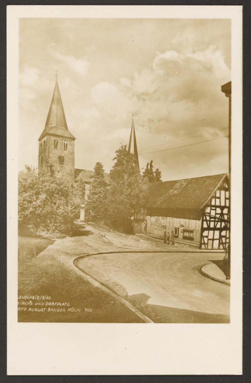 Church and town square, Leuscheid on the Sieg, Westerwald (Kirche und Dorfplatz, Leuscheid an der Sieg, Westerwald).