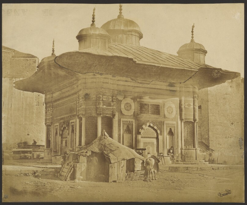 [Building with tent and horse]