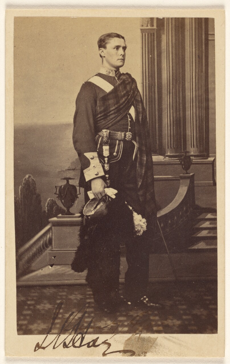 [Unidentified man with sash, standing]