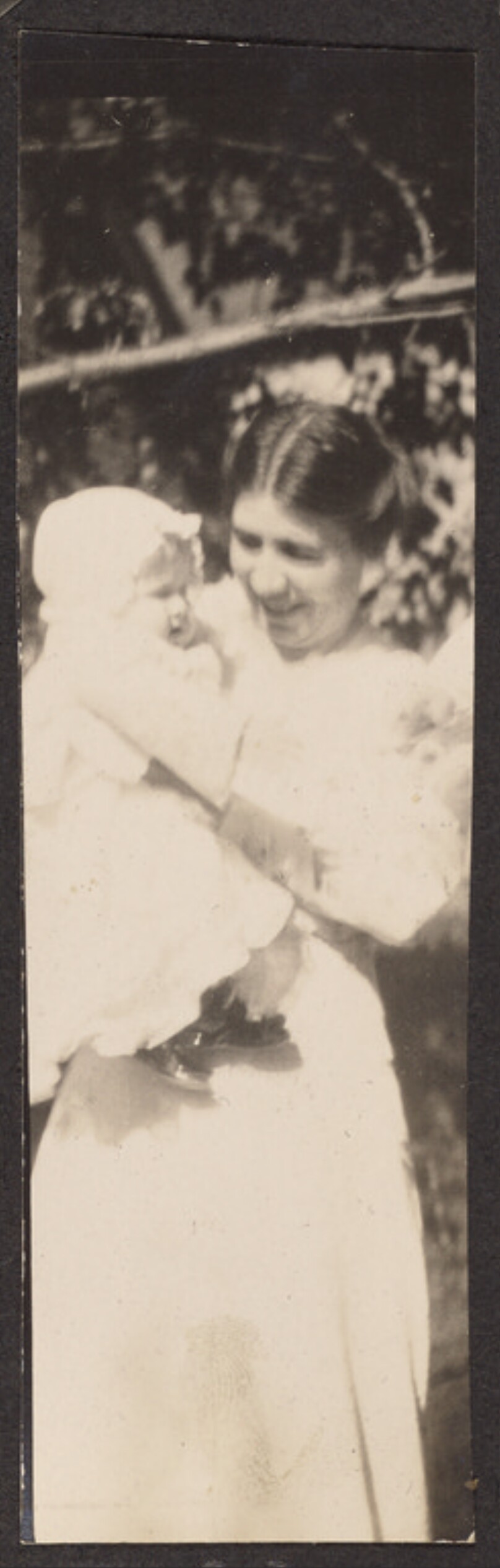 [Woman holding a baby]