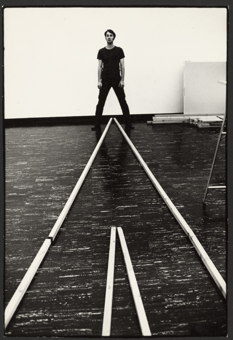 Bruce Nauman standing above wood strips (vertical), San Jose, California