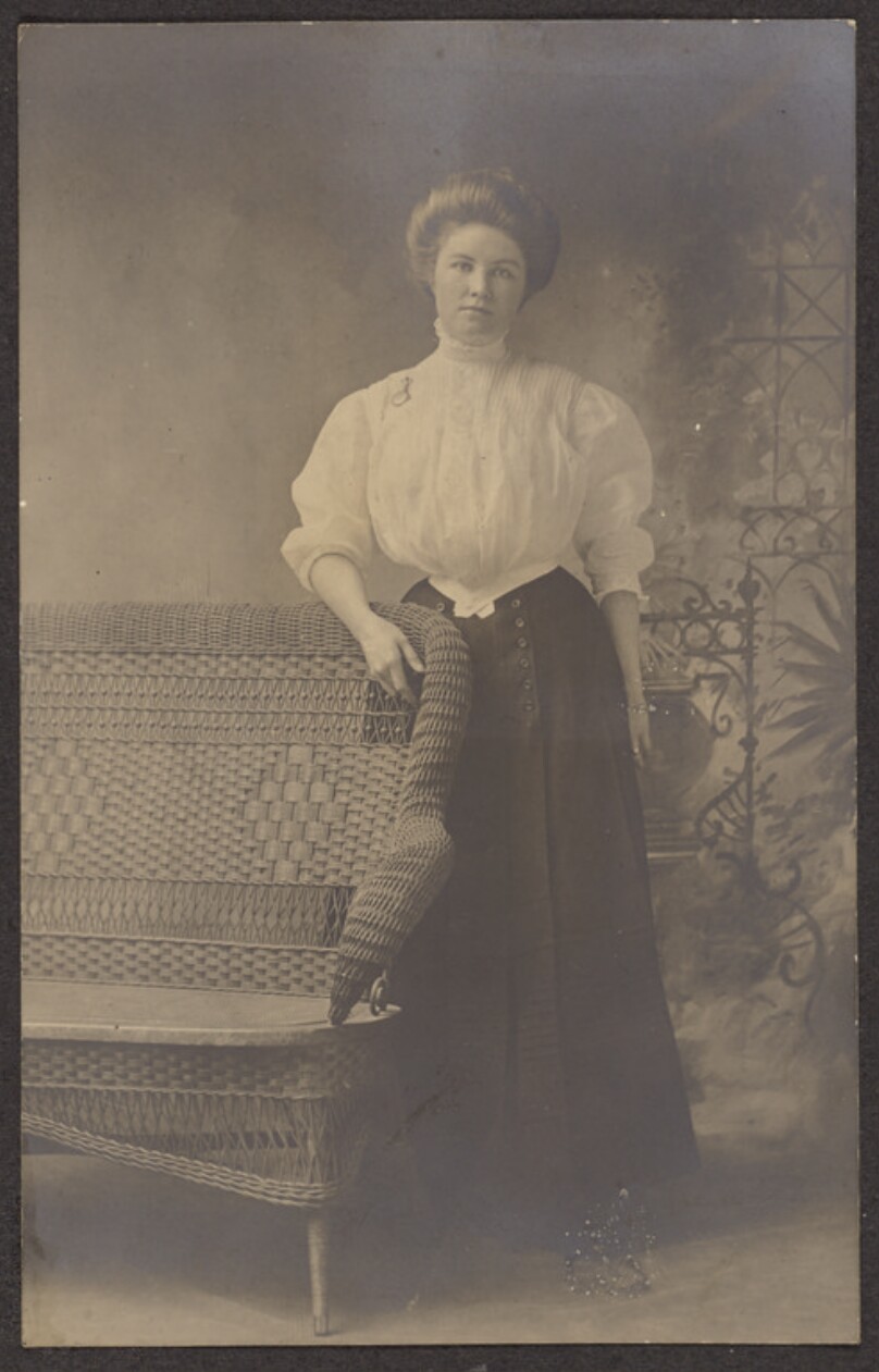 [Portrait of a woman next to a bench]