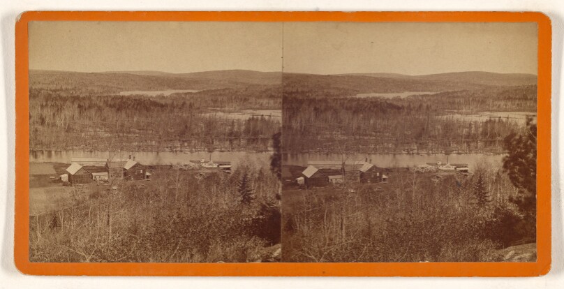 [High angle view of a landscape showing a river with docked paddleboat, farmhouse at center, lakes in background]