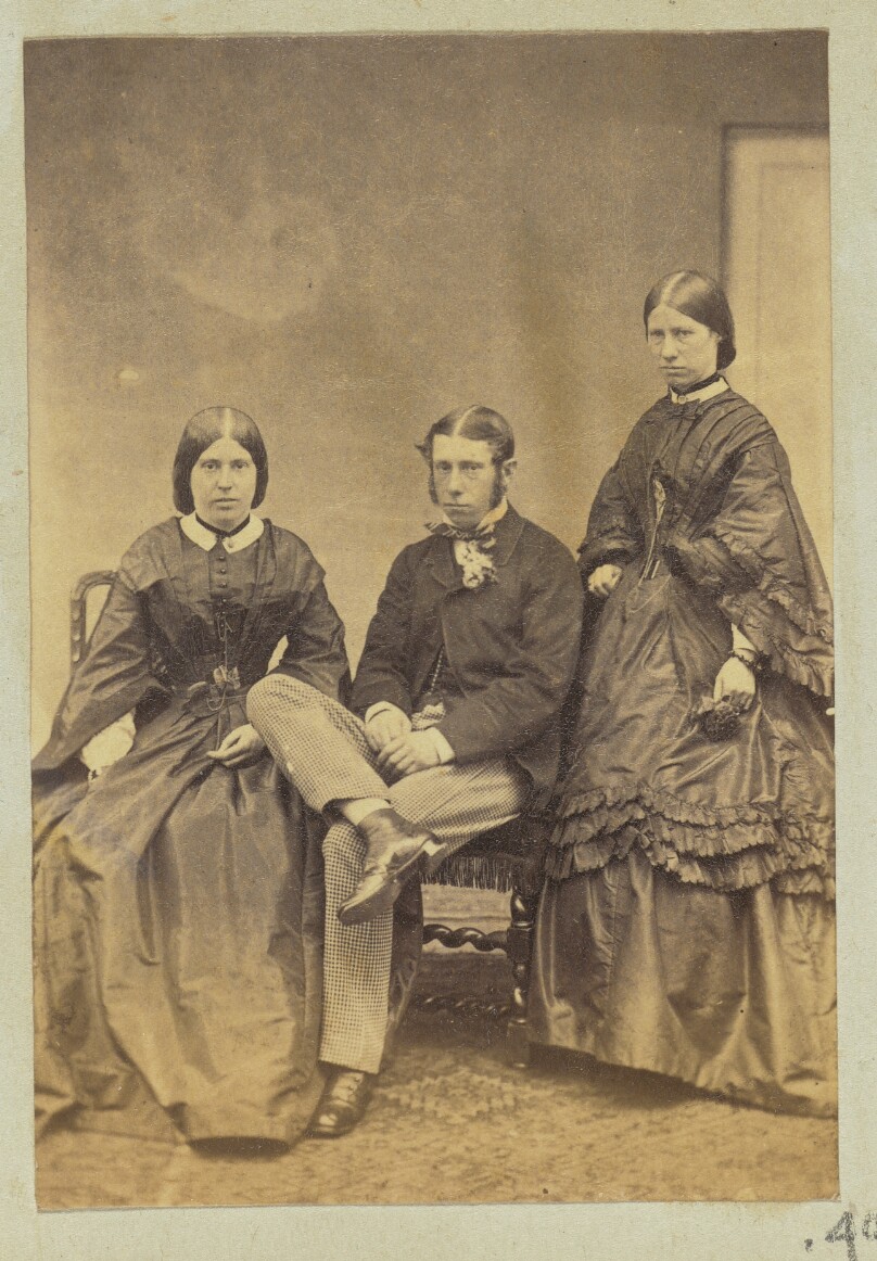 [Portrait of man and two women]
