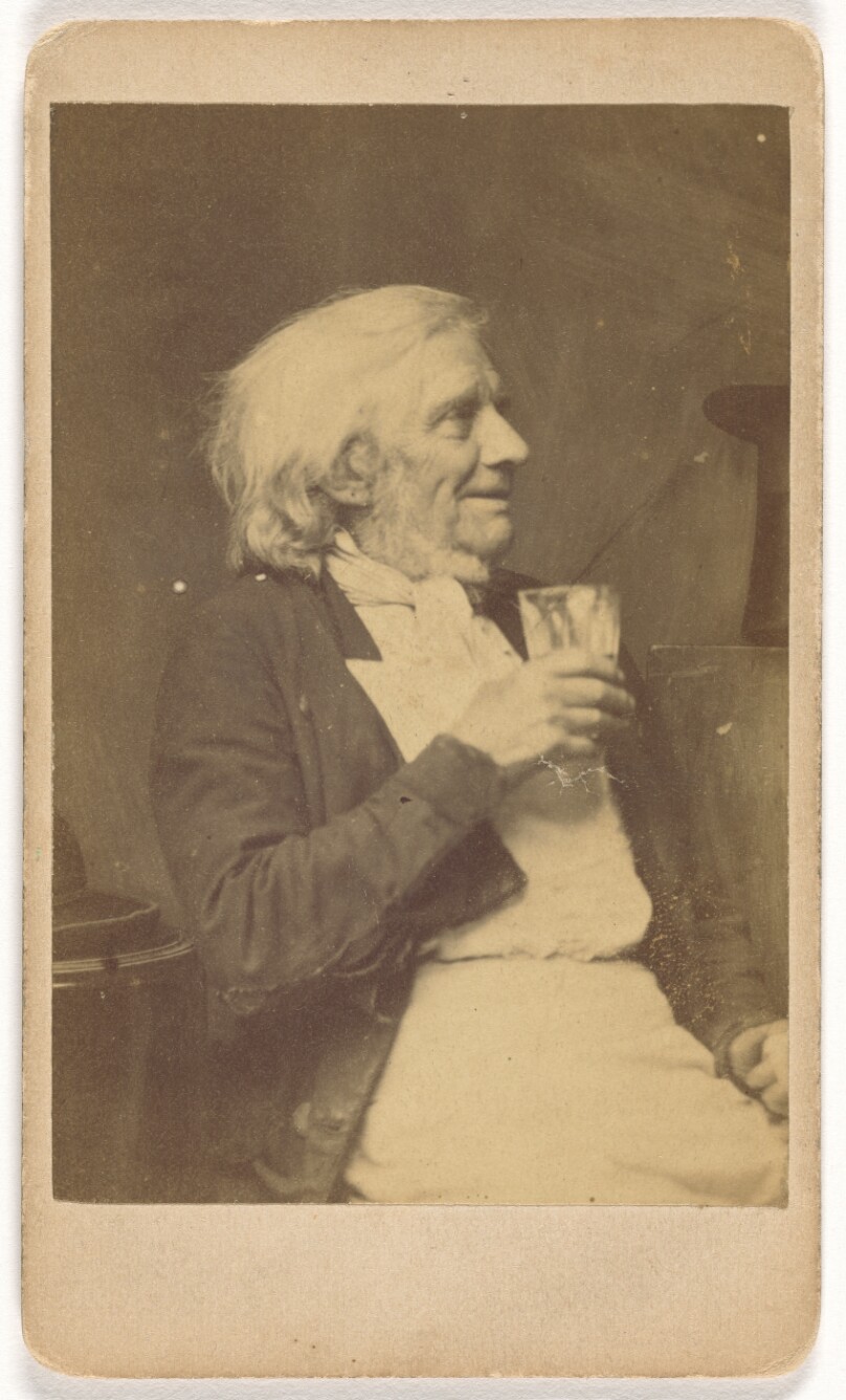 [Seated Elderly Man Holding a Glass]