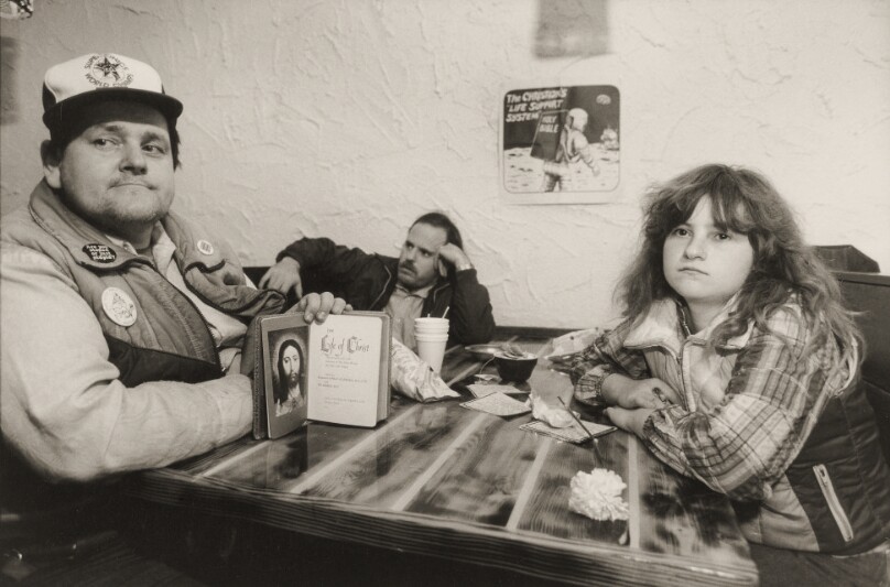 [Laurie and Companions at a Table]