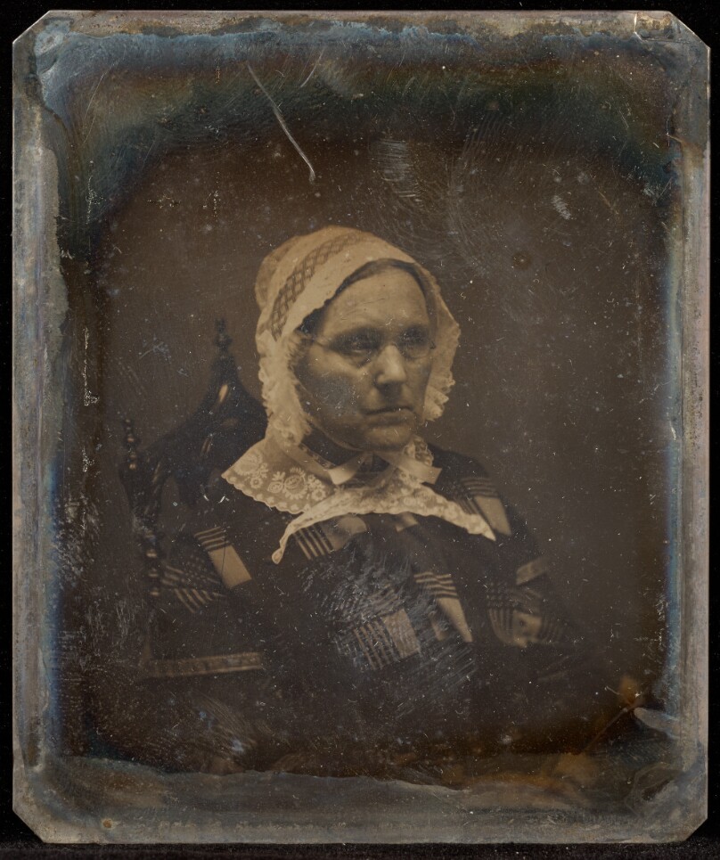 [Portrait of a Seated Woman Wearing Octagonal-shaped Glasses in Matron Cap]